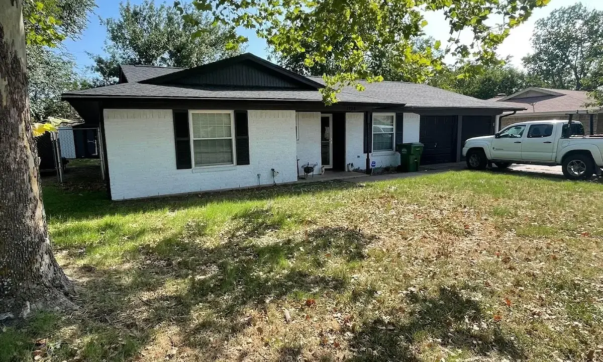 Professional roofing crew working on a residential roof in Middleburg Heights